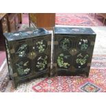 A Pair of XX Century Black Lacquered Chinese Style Side Cabinets, with applied relief decoration