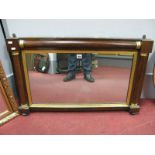 A XIX Century Rosewood Framed Rectangular Wall Mirror, with gilt terminals to split pilasters.