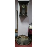 A Circa 1900 Mahogany Cased Vienna Style Wall Clock, (incomplete) and four oval wall mirrors. (5)