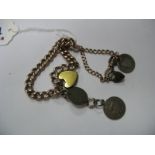 A Curb Link Bracelet, with associated heart shape pendant clasp, suspending two coins; together with