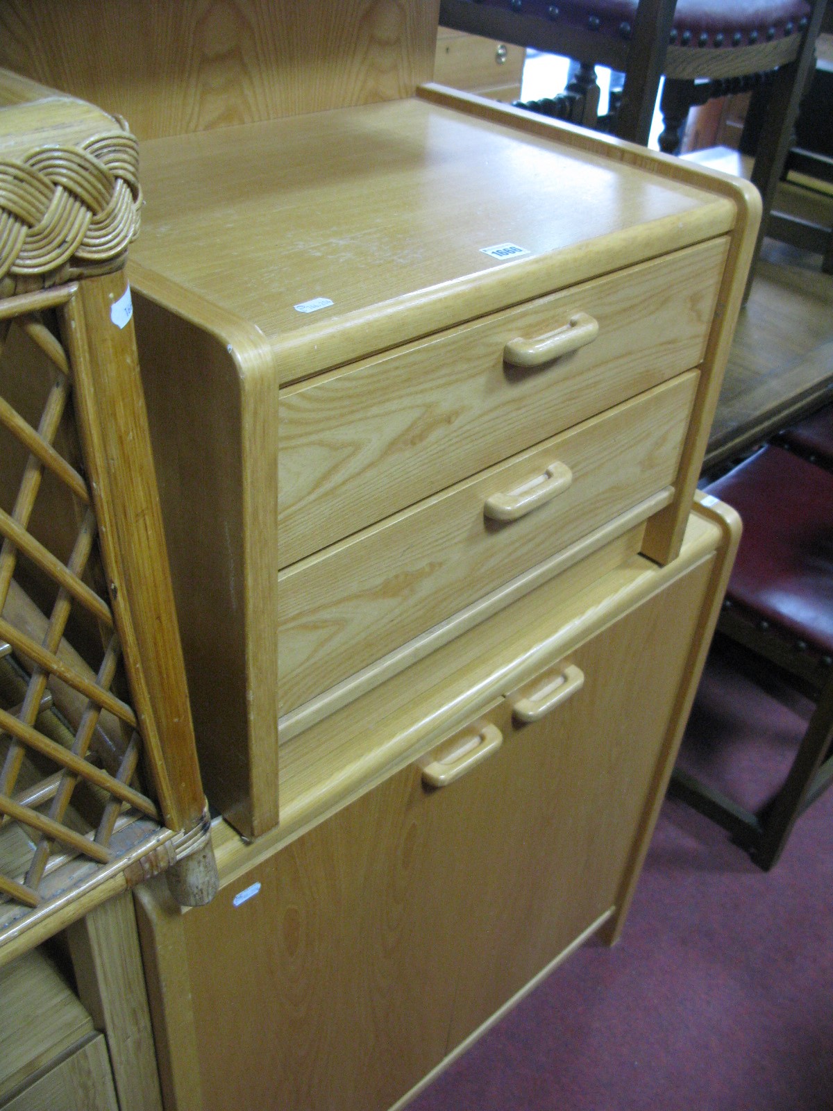 A Modern Pine Effect Cupboard, matching bedside chest and a cane framed glass topped occasional