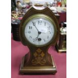 An Edwardian Inlaid Mantel Clock, with enamel dial, stepped base, on brass bun feet.