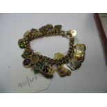 A 9ct Gold Curb Link Charm Bracelet, to 9ct gold heart shape padlock clasp, suspending numerous