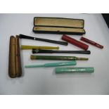 Six Art Deco Cheroot Holders, including engine turned telescopic example, cased examples, etc.