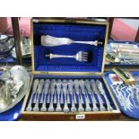 A Highly Decorative Set of Twelve Plated Fish Knives and Forks, initialled; together with matching