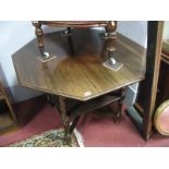 An Early XX Century Walnut Window Table, with octagonal top, turned, block and spiral twist supports