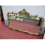 A Gilt Metal Wall Mirror, of shaped rectangular form, scroll and foliate frame with feather