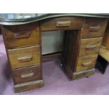 A Stained Pine Kidney Shaped Desk, with central frieze drawer flanked by two three drawer pedestals,