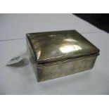 A Hallmarked Silver Cigarette Box, of rectangular form with engine turned lid, initialled, 11.5cm