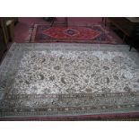 A Middle Eastern Style Fringed Wool Rug, central lozenge within a red field, blue spandrels on