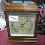 Elliott Walnut Cased Mantel Clock, on brass bun feet.