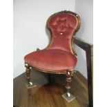 XIX Century Walnut Framed Nursing Chair, with carved cresting to spoon back, fluted legs and pot