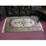 ,A XX Century Persian Style Fringed Rug, central medallion within foliate surround and