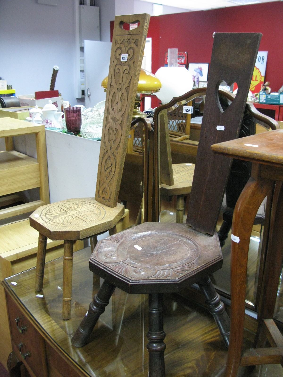 Two Carved Oak Spinning Chairs, relief decoration of scrolls, foliage and Celtic motifs and a