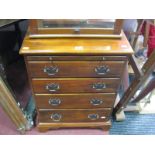 A Later XX Century Hardwood Chest of Drawers, of small proportions, tooled tan leather brushing