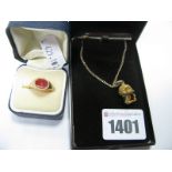 A 9ct Gold Hardstone Inset Signet Ring; together with a 9ct gold novelty charm pendant on a chain.