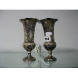 A Pair of Hallmarked Silver Vases, (hallmarks rubbed) each with flared rim, on pedestal base (