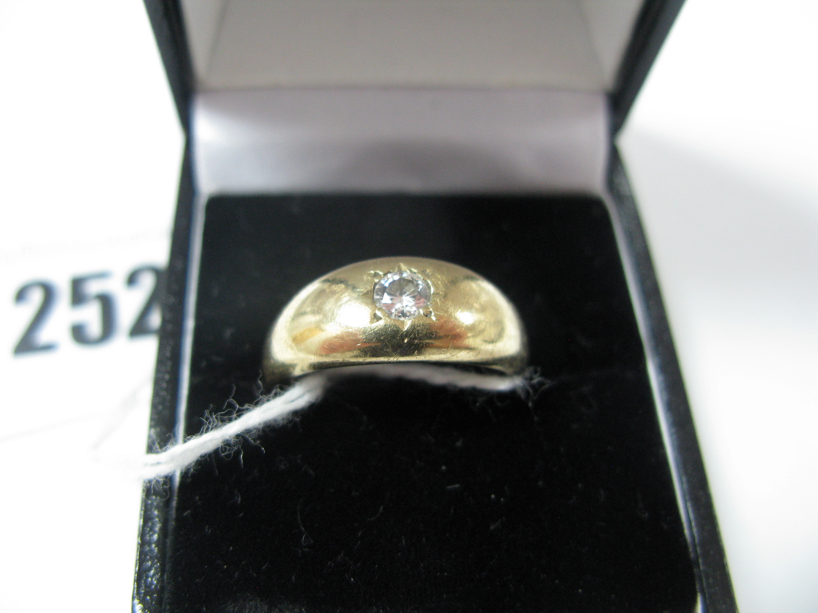 A Gent's 9ct Gold Single Stone Diamond Ring, the brilliant cut stone star set.