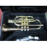 An 'Eterna By Getzen USA' Cornet Brass Instrument, numbered G03095, with mother of pearl buttons;