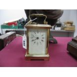 A London Clock Company Brass Cased Carriage Clock, Roman numerals, clear bevelled glass surround,