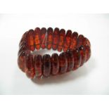 A Modern Amber Coloured Bracelet, elasticated.