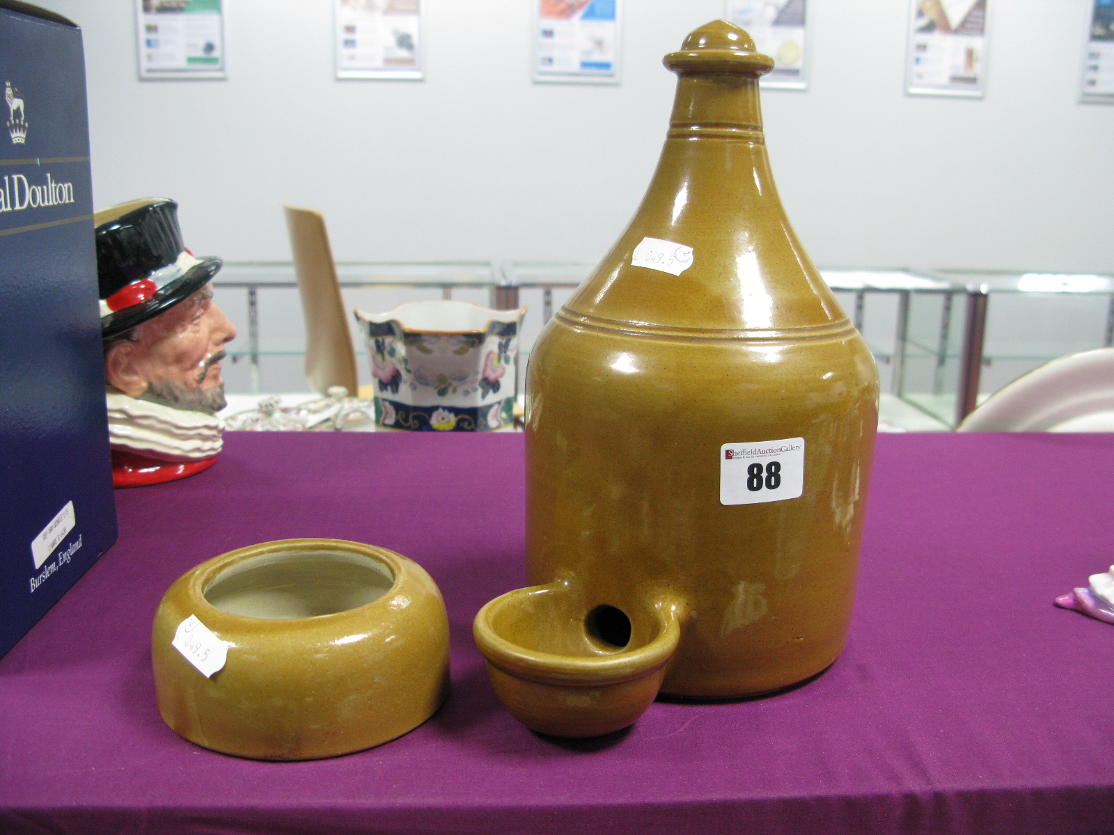 A Stoneware Pigeon Feeder; together with a stoneware water bowl. (2)