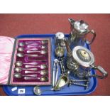 An Electroplated Pepperette, teapot, hot water jug, cased coffee spoons (eleven of twelve spoons and