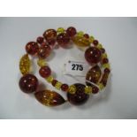 A Modern Amber Coloured Bead Necklace, of graduated design, to screw clasp.