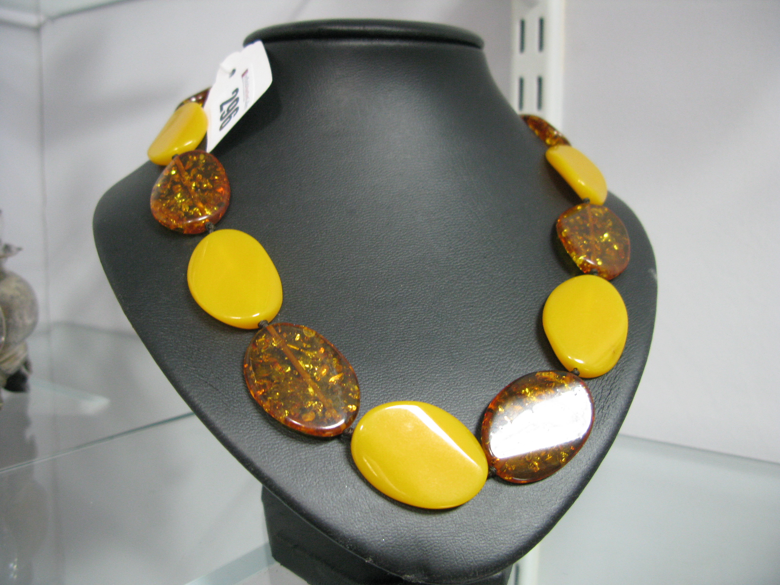 A Modern Amber Coloured Two Tone Necklace, to screw clasp.