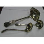 A Pair of Ladles, each of hand hammered finish; together with a twin spout Kings Pattern ladle. (3)