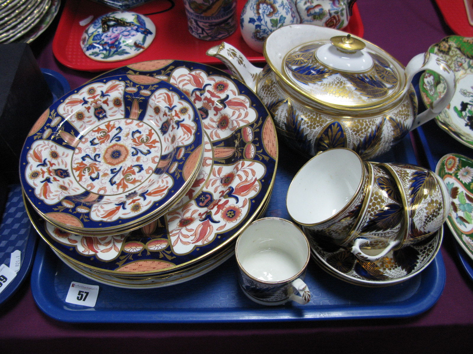 An Early XIX Century Miles Mason Teapot, matching cups and saucers; a collection of Imari plates