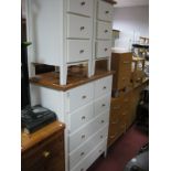 White Melamine Chest, of four short and three long drawers. A pair of similar bedside chests.