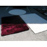 A Colours Burgundy Rug, 120 x 170cm and two cream examples. (3)