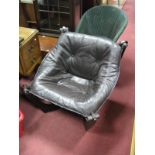 A Thai Made Low Easy Chair, upholstered in a brown button back leather.