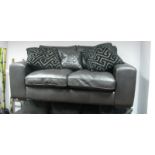 A Dark Brown Soft Leather Two Seater Settee.