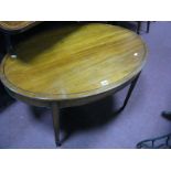 An Oval Shaped Mahogany Coffee Table, on tapering legs.