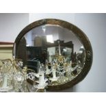 Oval Bevelled Wall Mirror, in oxidized copper leaf bordered frame.