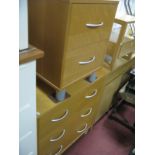 A Pine Effect Chest, of two short and two long drawers, having arched handles; together with