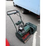 An Atco Balmoral 17 SE Petrol Driven Lawn Mower, and grass basket.