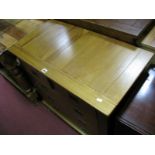 A Light Wood Chest, of two short and three long drawers, having campaign handles, 84cm wide.