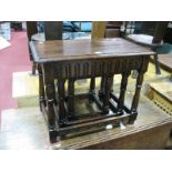Oak Nest of Tables, with a moulded edge, knulled decoration, on turned and block supports.