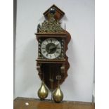 A Dutch Wall Clock, with twin pear shape weights.