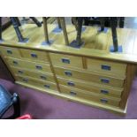 A Light Wood Elongated Chest, of four small and six long drawers having campaign handles, 153 wide.