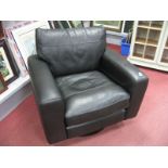 A Dark Brown Leather Easy Chair, with swivel action, on circular base.