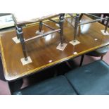 A Mahogany Pedestal Table, with cross banded top, drop leaves, turned pedestal on splayed legs,