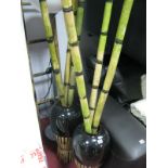 An Ikea Standard Lamp, bamboo ladder poles and effect vases, (untested: sold for parts only).