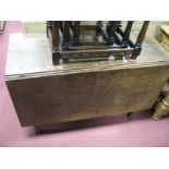 A Late XVIII Century Oak Drop Leaf Table, on square legs.