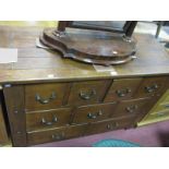 A Modern Hardwood Multi Drawer Sideboard, with a configuration of four, three and two small drawers,