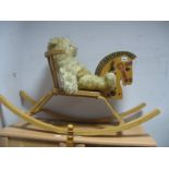 Teddy Bear, seated on a Child's Rocker.