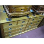 A Light Wood Elongated Chest, of four short and six long drawers, having campaign handles, 153cm